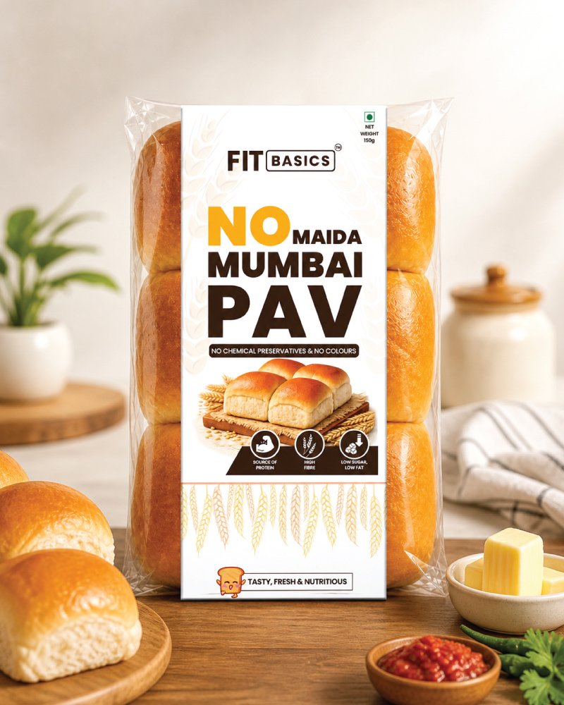 Golden-brown Mumbai Pav buns dusted with flour on a marble surface