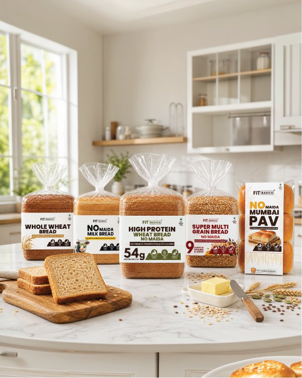 Artisanal no-maida breads including multi-grain, sourdough, and rye on a minimalist marble counter